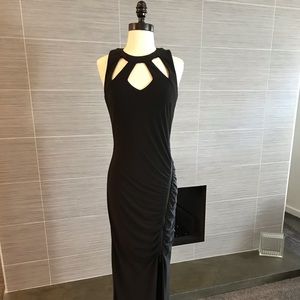 Sexy, long black dress, sleeveless.